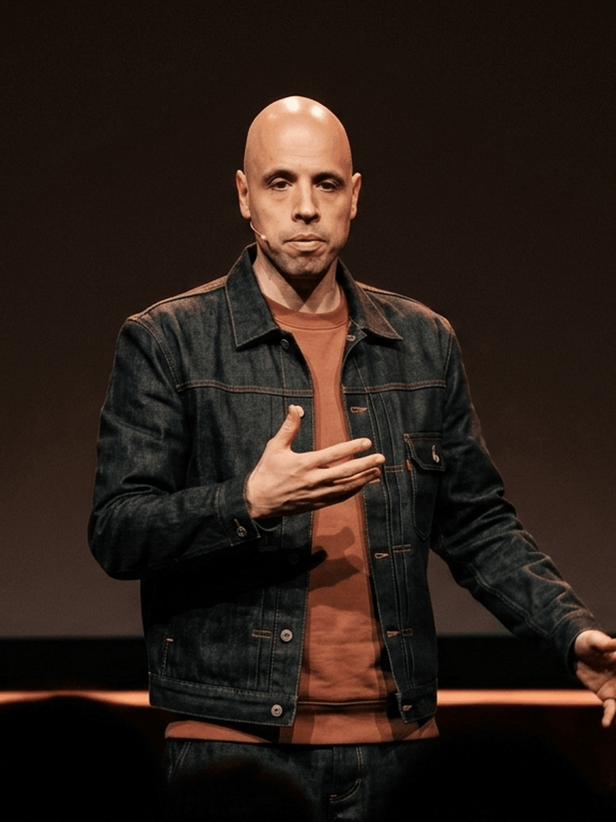 Rutger Tuit — stage portrait, performance and speaking context (AI-generated, not a photograph)